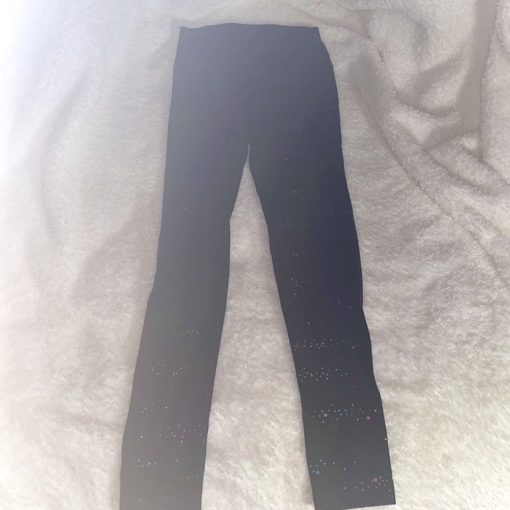 black crop leggings with rainbowstargalaxy pattern